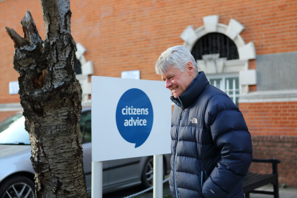 Mature man outside Citizens Advice office